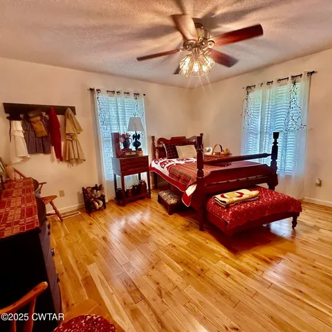 a bedroom with furniture and a chandelier