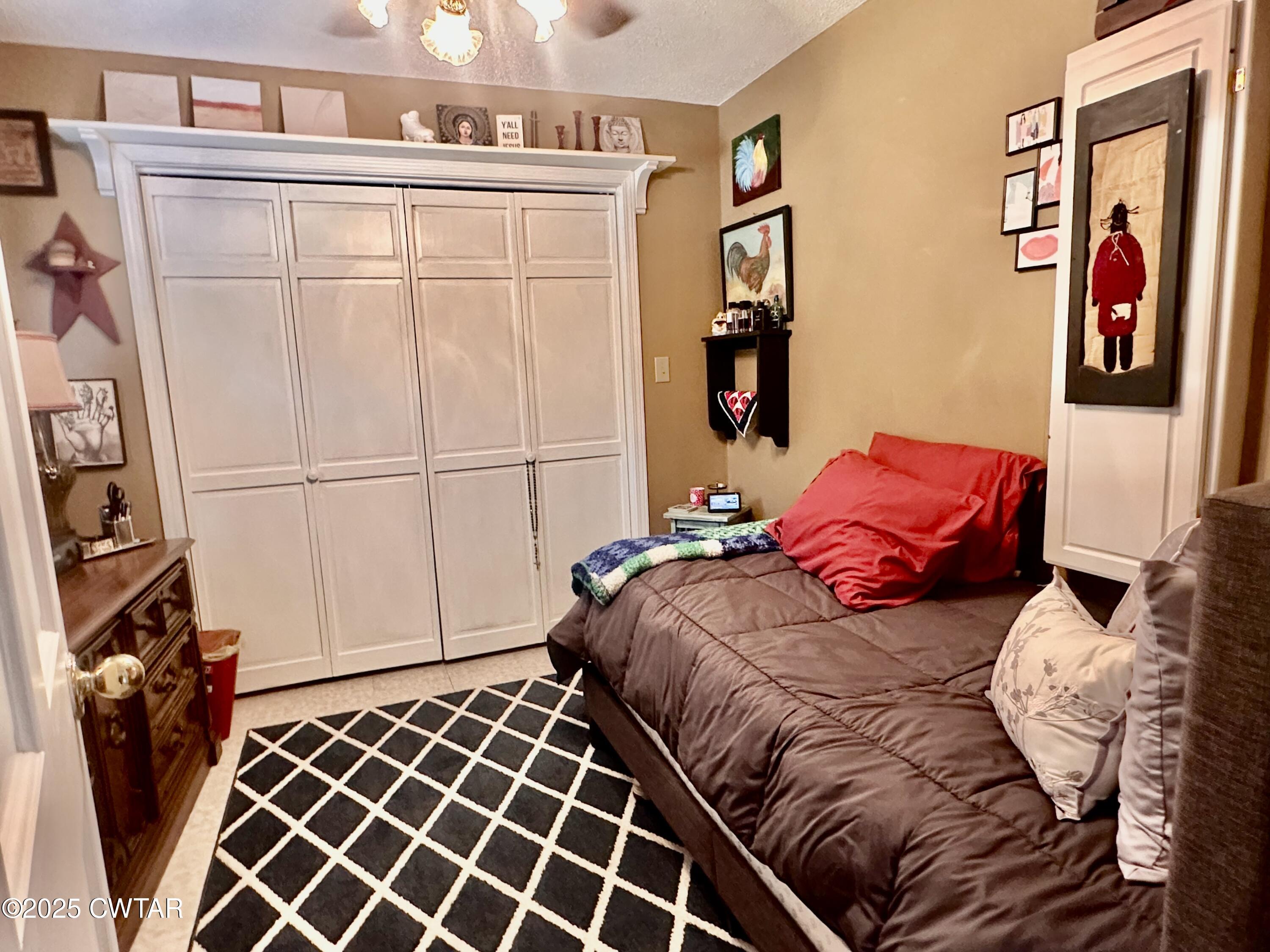 4310 Old Samburg Road Hornbeak, TN 38232 - Photo 12 of 20 a bedroom with a bed and a window