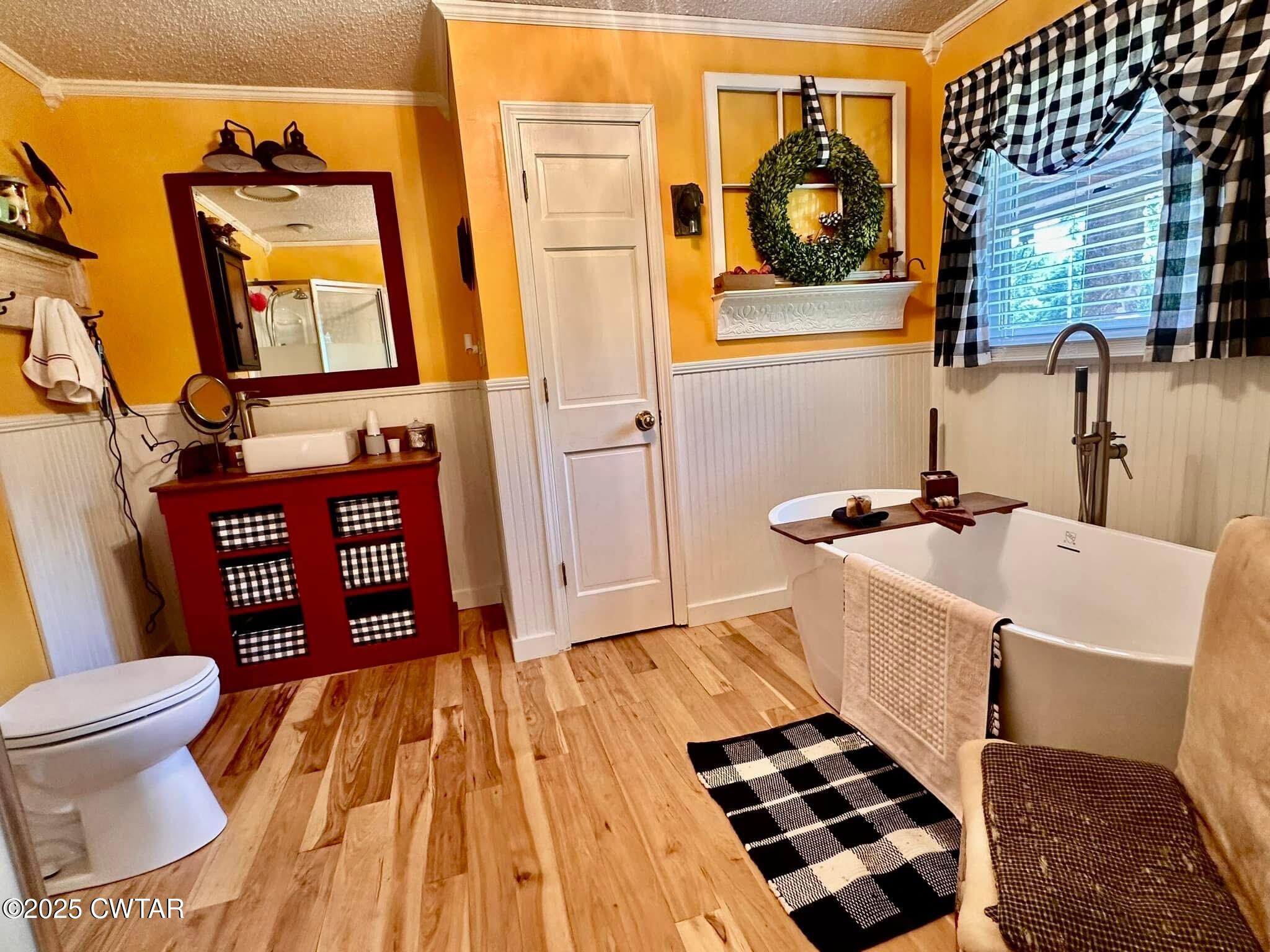 4310 Old Samburg Road Hornbeak, TN 38232 - Photo 14 of 20 a bathroom with a sink a toilet and a mirror