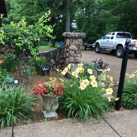 a couple of cars parked in front of a house