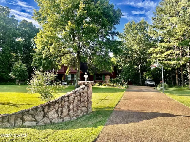 a view of a swimming pool with a garden