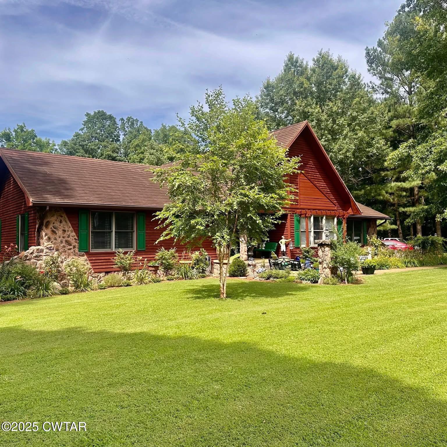 4310 Old Samburg Road Hornbeak, TN 38232 - Photo 20 of 20 a front view of house with yard and green space