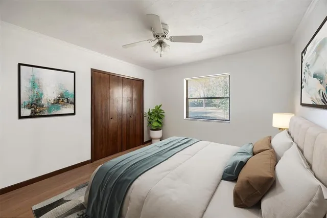 a workspace with wooden floor and windows