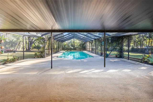 a view of a swimming pool with a patio