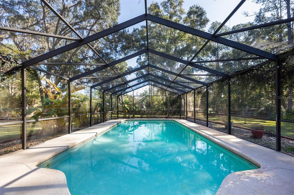 3811 Southwest 82nd Street Gainesville, FL 32608 - Photo 19 of 24 a view of a swimming pool with a patio