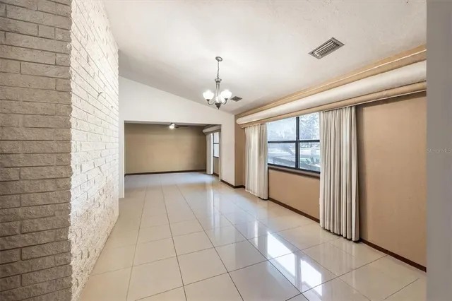 a view of an empty room and window