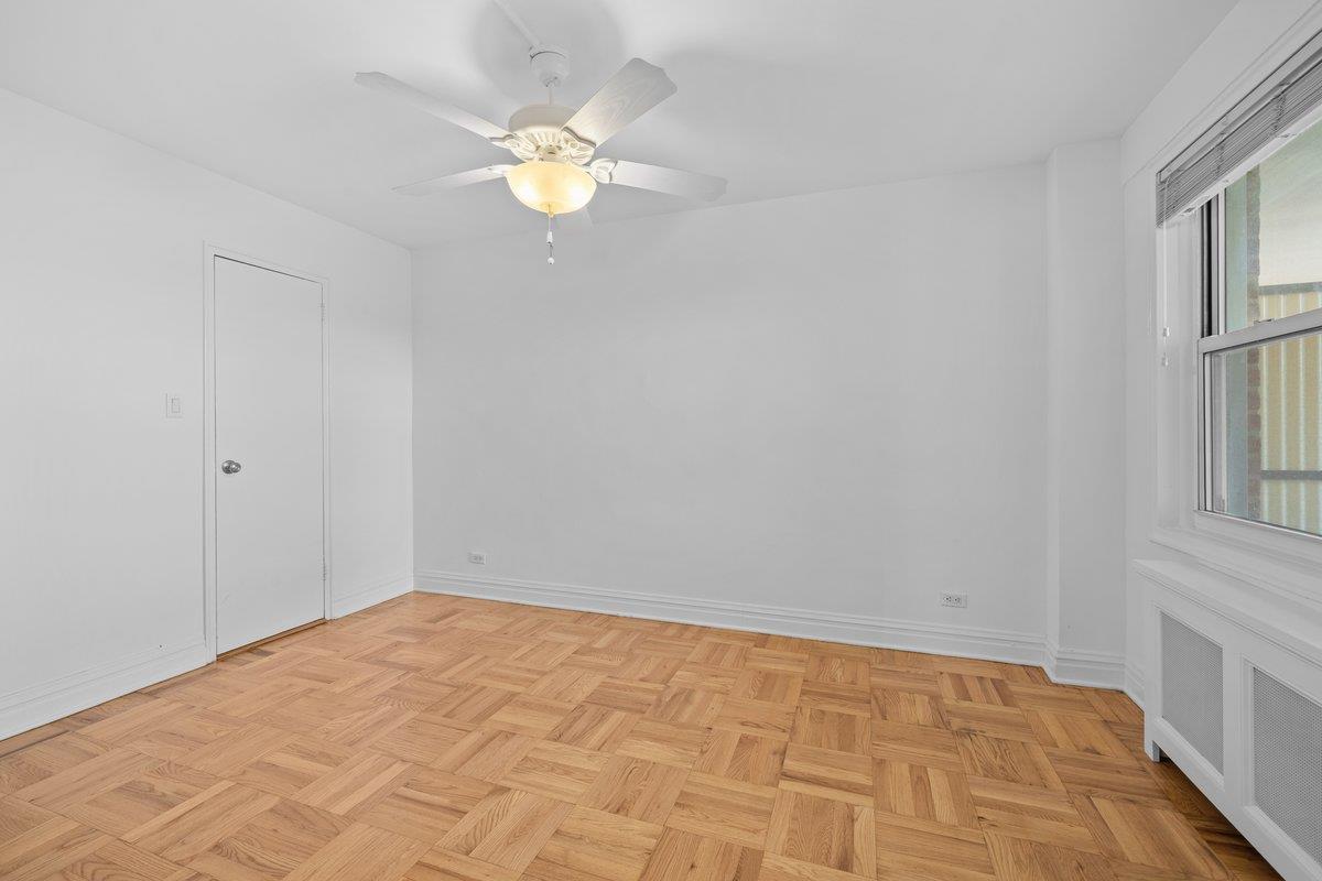 4525 Henry Hudson Parkway West, Unit 609 Bronx, NY 10471 - Photo 11 of 26 wooden floor in an empty room with a window