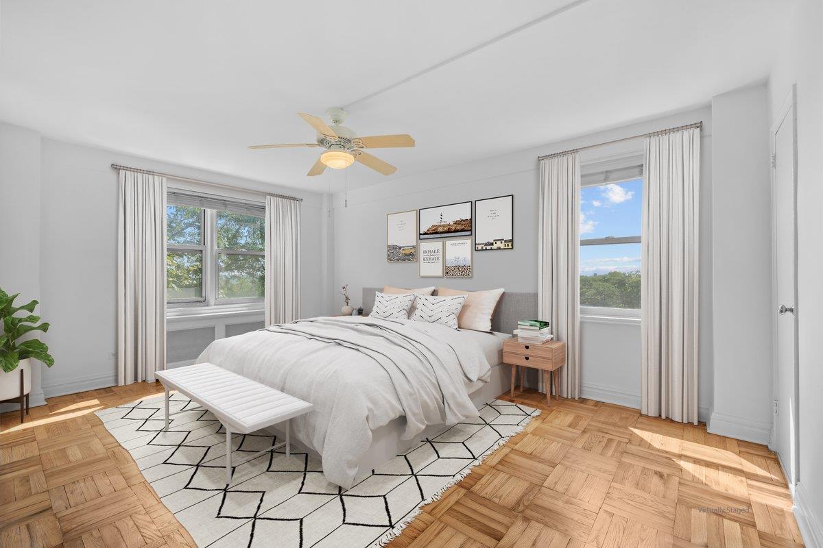 4525 Henry Hudson Parkway West, Unit 609 Bronx, NY 10471 - Photo 4 of 26 a bedroom with a bed and a window