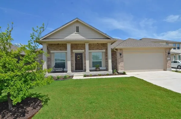 front view of a house with a yard