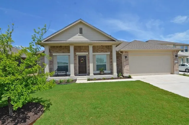 front view of a house with a yard