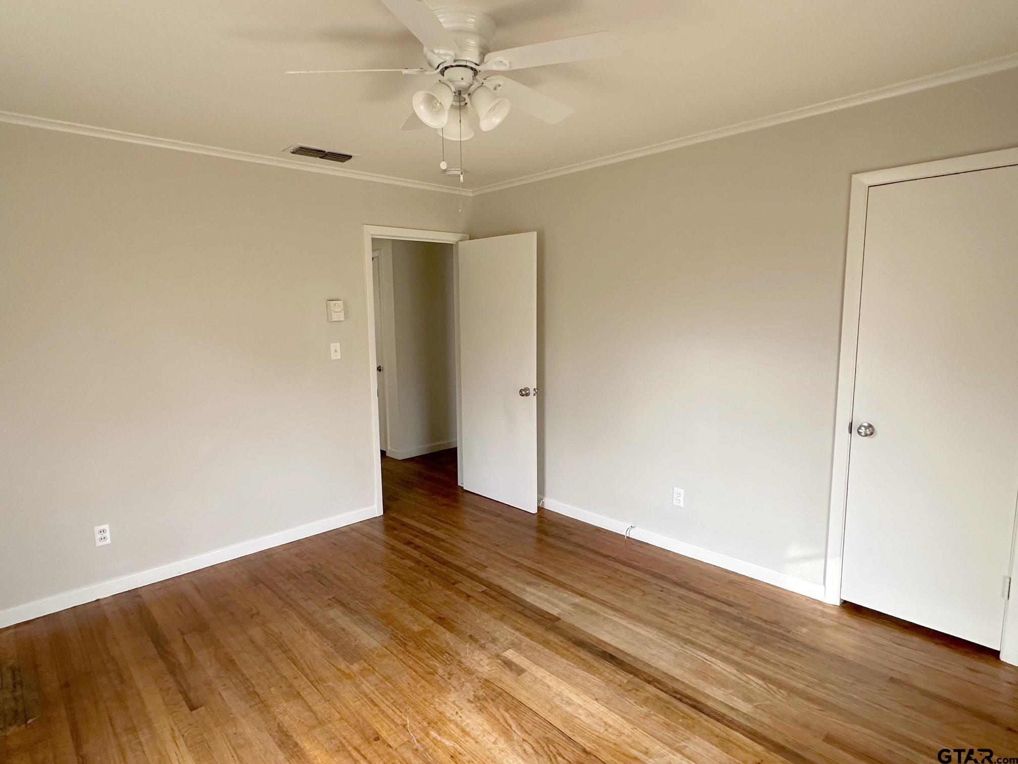 2331 Lingner Drive Tyler, TX 75701 - Photo 12 of 17 a view of an empty room with wooden floor