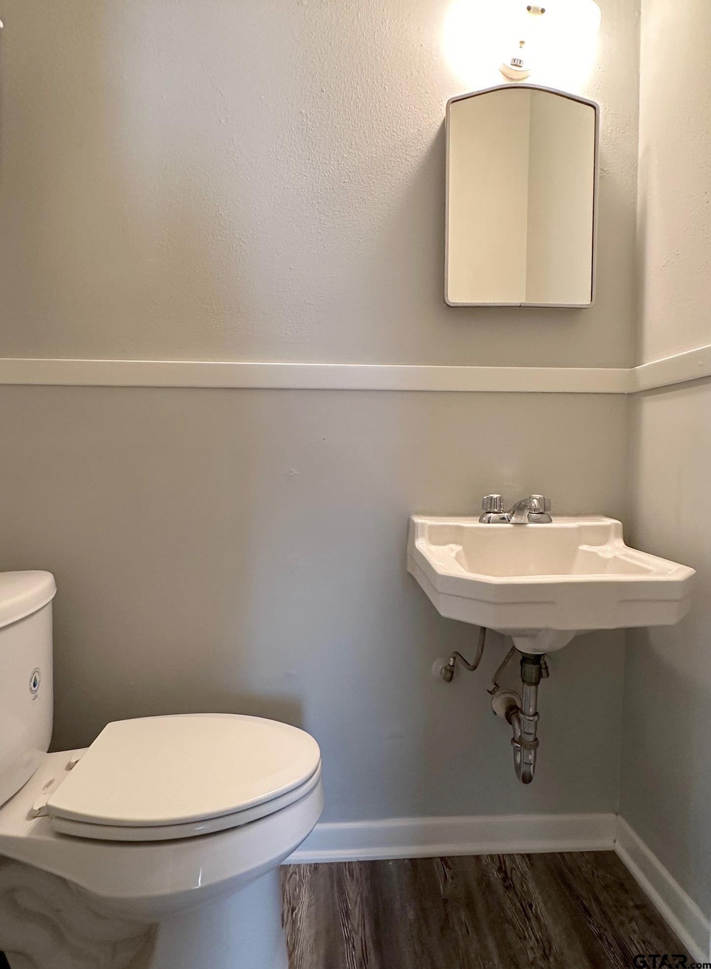 2331 Lingner Drive Tyler, TX 75701 - Photo 13 of 17 a bathroom with a sink a toilet and mirror