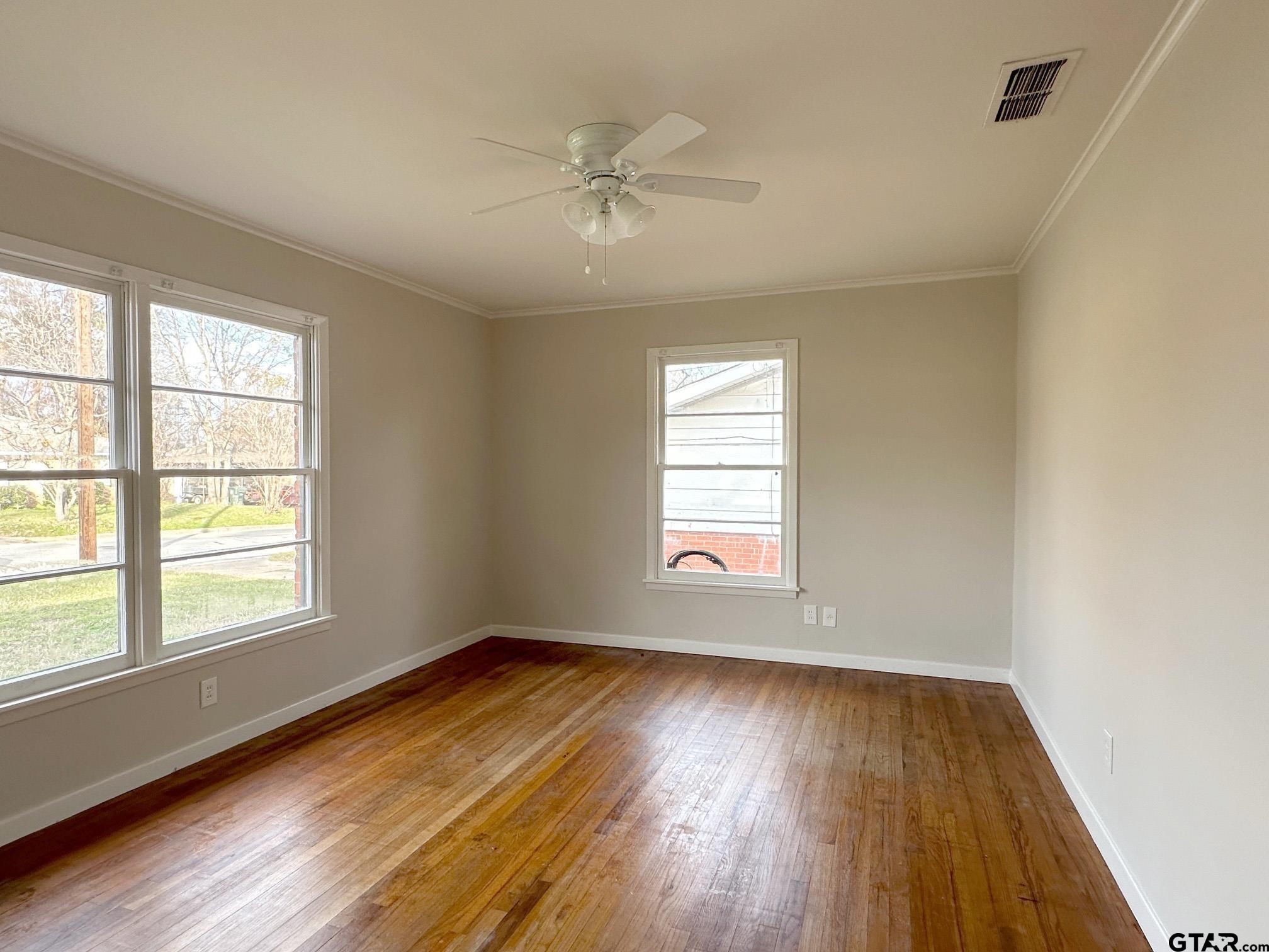 2331 Lingner Drive Tyler, TX 75701 - Photo 14 of 17 a view of an empty room with wooden floor and a window