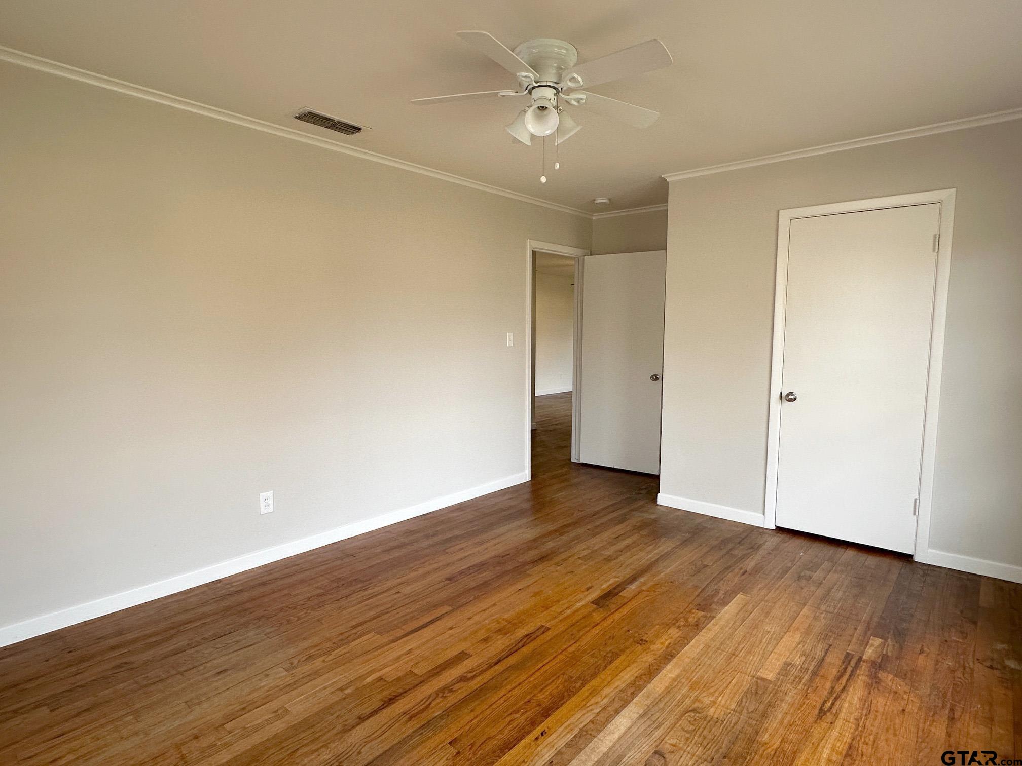 2331 Lingner Drive Tyler, TX 75701 - Photo 15 of 17 a view of an empty room with wooden floor