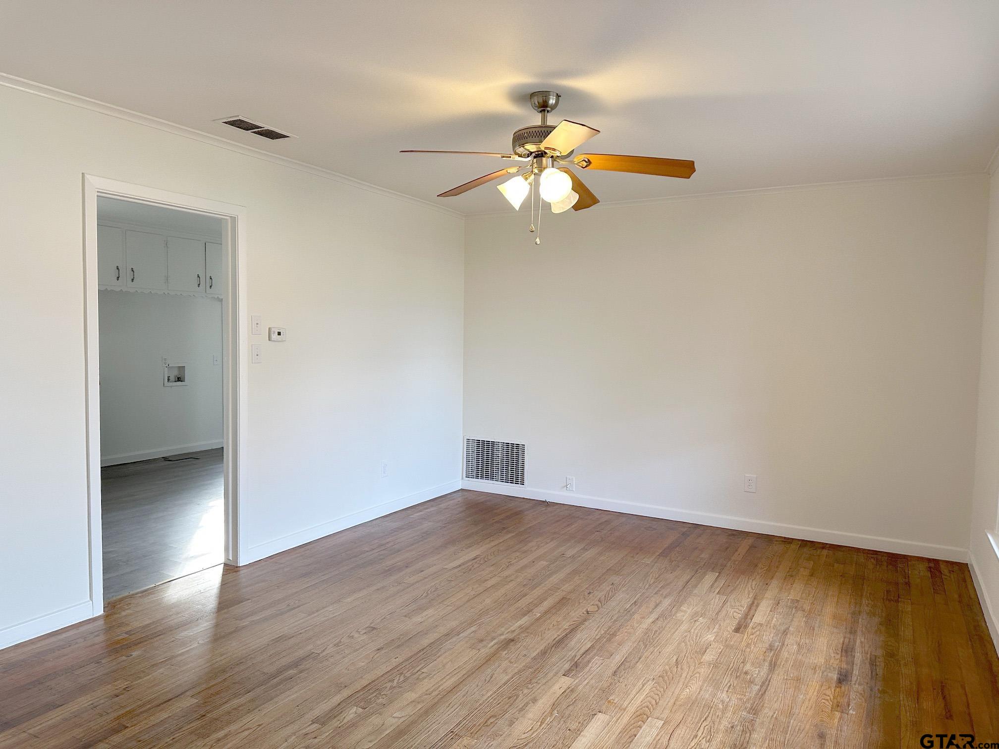 2331 Lingner Drive Tyler, TX 75701 - Photo 3 of 17 wooden floor in an empty room with a window