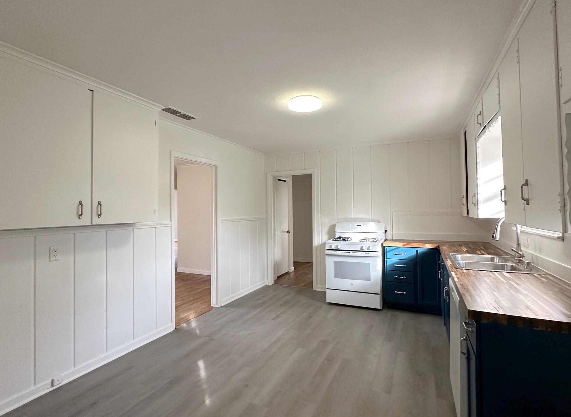 2331 Lingner Drive Tyler, TX 75701 - Photo 5 of 17 a kitchen with granite countertop a sink and steel appliances