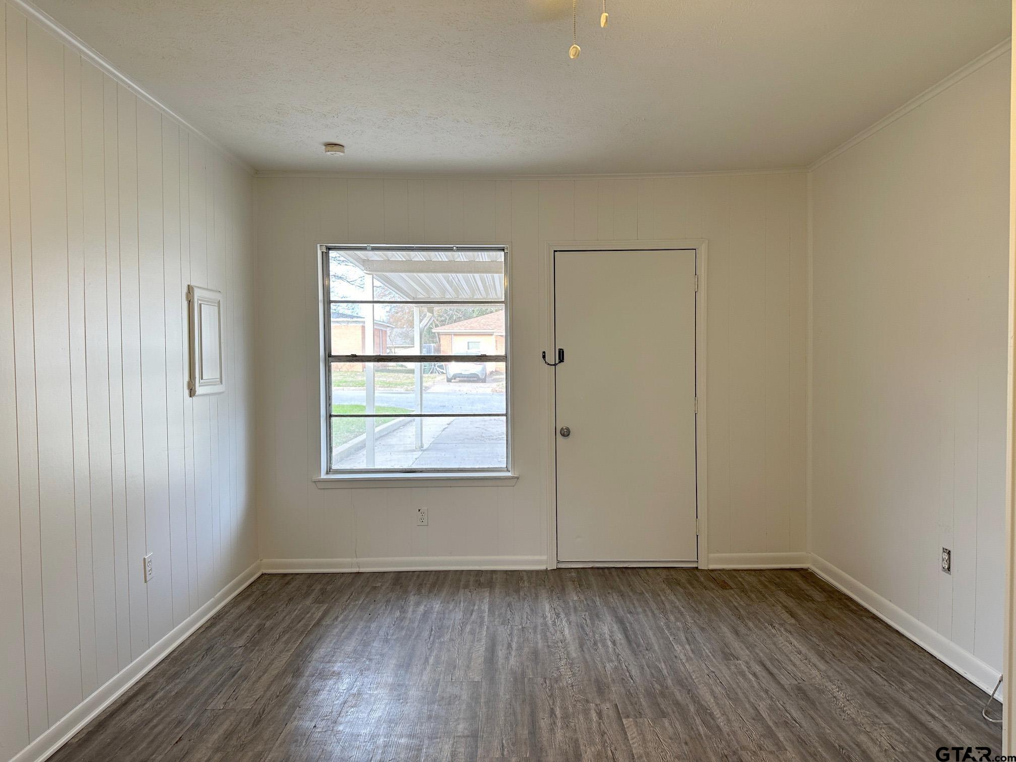 2331 Lingner Drive Tyler, TX 75701 - Photo 7 of 17 an empty room with wooden floor and windows