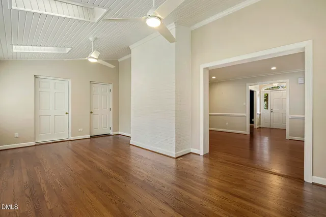 a kitchen with white cabinets and a sink