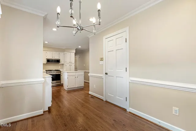 a bathroom with a double vanity sink toilet and a mirror