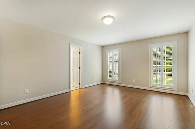 a utility room with table and chairs