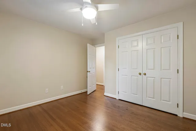 an aerial view of a house with garden space and street view