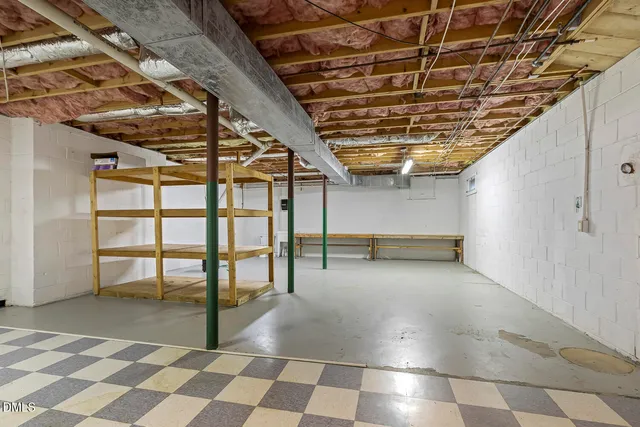 an aerial view of residential house with outdoor space and trees around