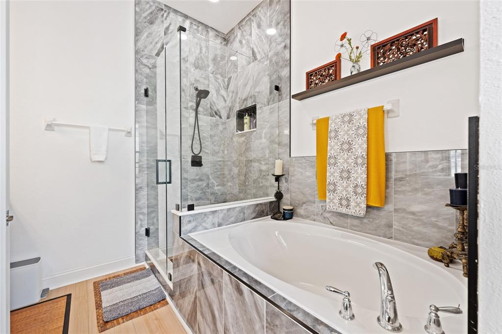 1819 Common Way Road, Unit 203 Orlando, FL 32814 - Photo 19 of 23 a bathroom with a tub and a shower