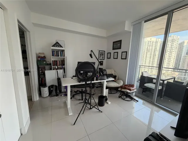 a work room with furniture and a window