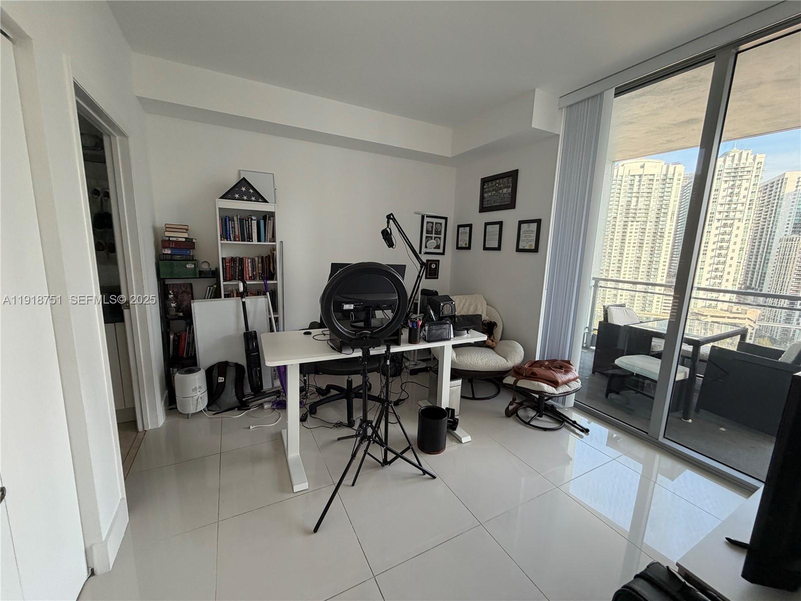 90 Southwest 3rd Street, Unit 2202 Miami, FL 33130 - Photo 15 of 33 a work room with furniture and a window