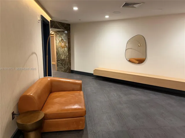 a living room with a couch and a large window