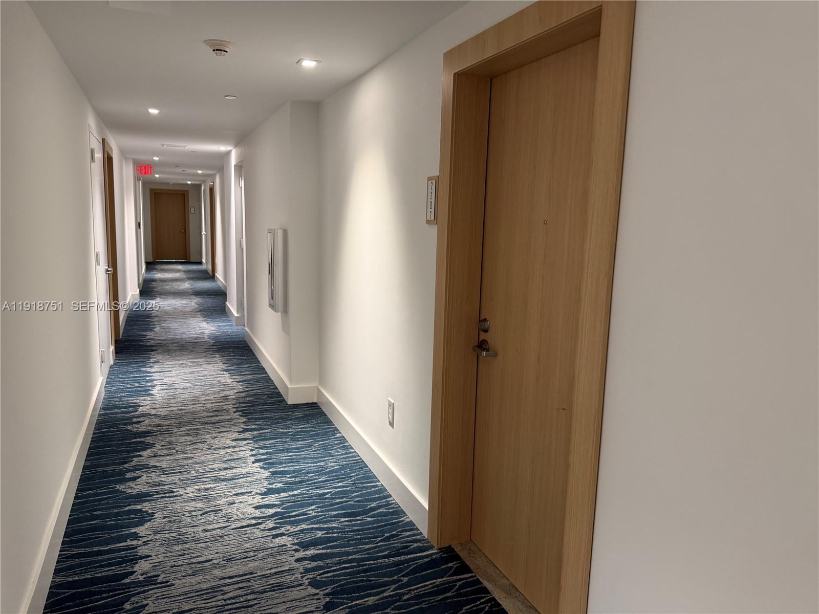90 Southwest 3rd Street, Unit 2202 Miami, FL 33130 - Photo 3 of 33 a view of a hallway with wooden floor