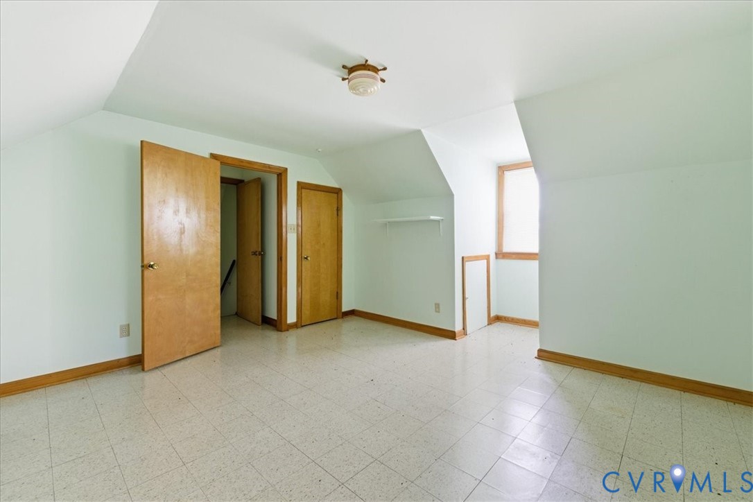 8100 Sandy Ridge Road Hopewell, VA 23860 - Photo 25 of 36 Room featuring sloped ceilings, light-colored wall