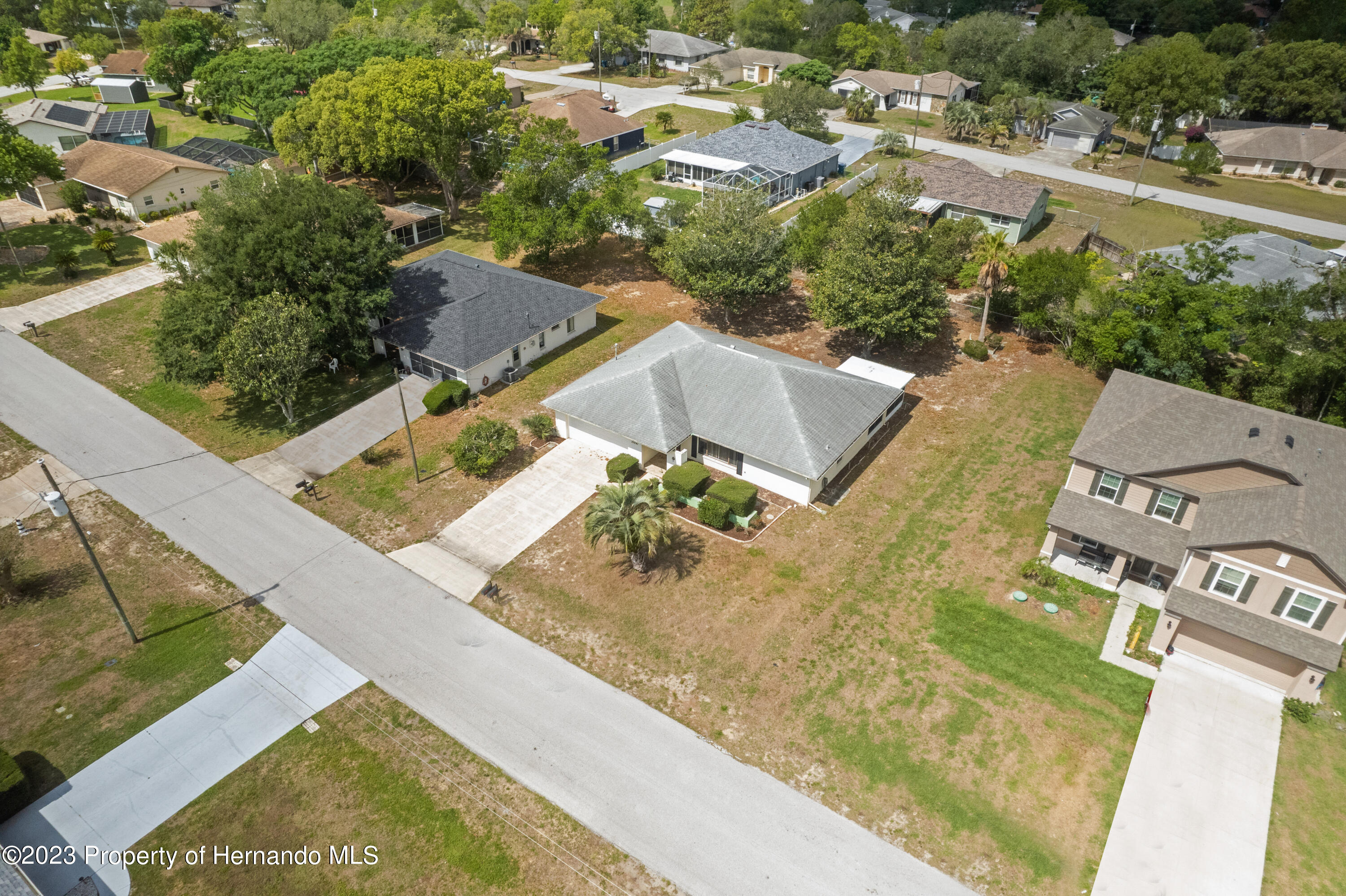 10241 Bedford Road Spring Hill, FL 34608 - Photo 25 of 32 an aerial view of residential houses with outdoor space