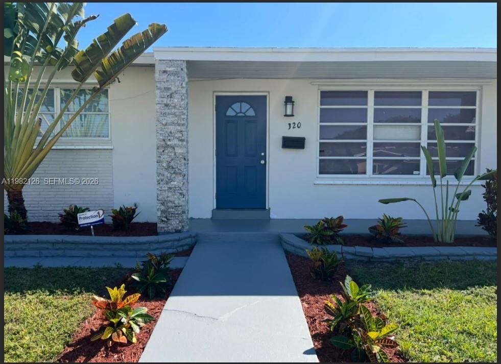 320 Southwest 7th Court Hallandale Beach, FL 33009 - Photo 1 of 5 a front view of a house
