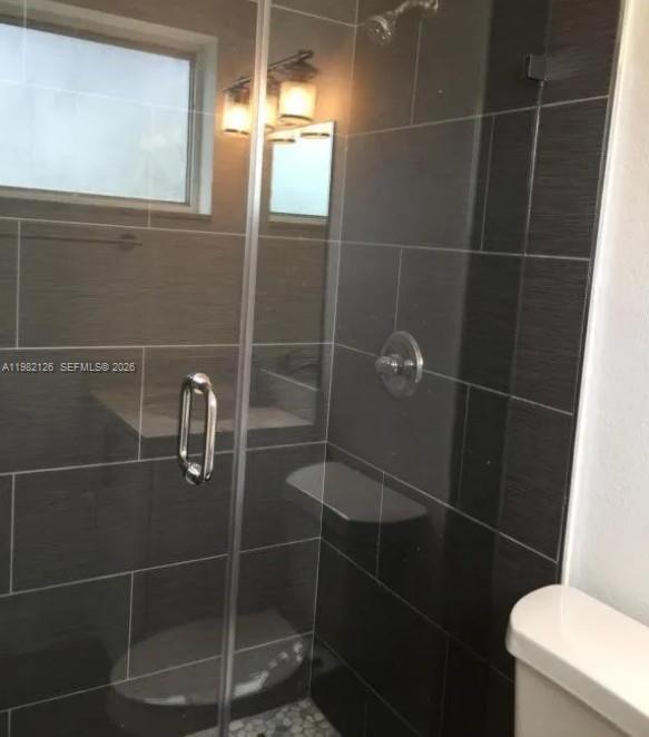 320 Southwest 7th Court Hallandale Beach, FL 33009 - Photo 3 of 5 a bathroom with a toilet