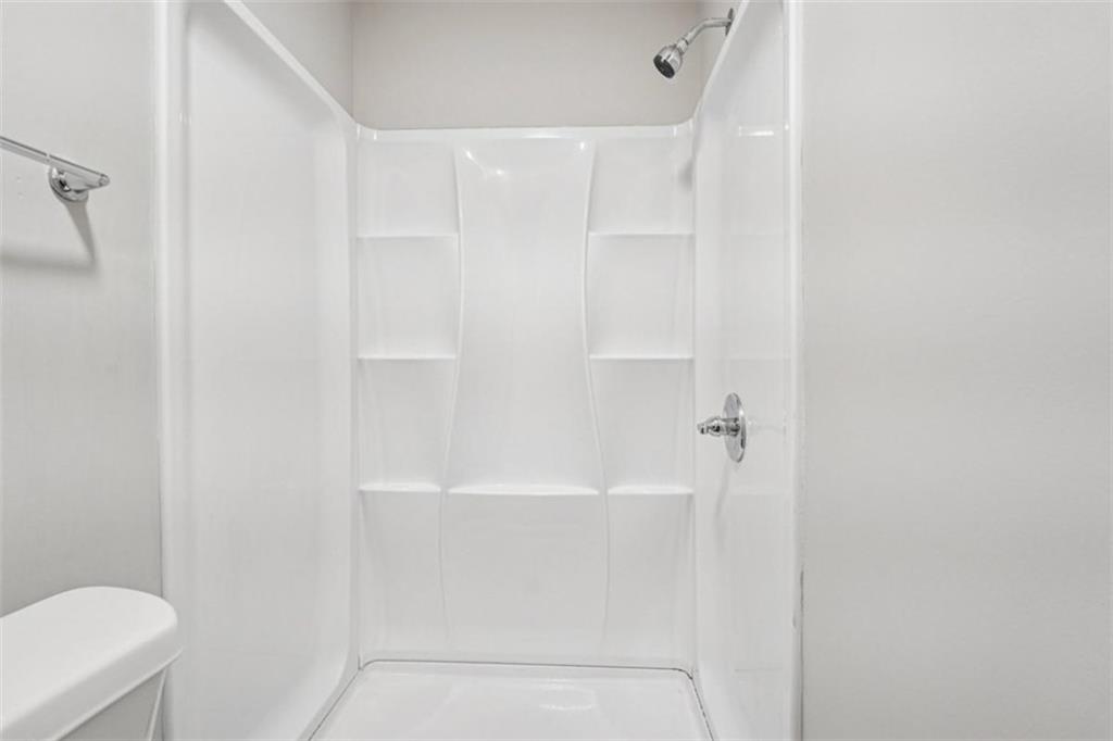 172 Meador Way Southeast Atlanta, GA 30315 - Photo 16 of 34 a bathroom with a shower