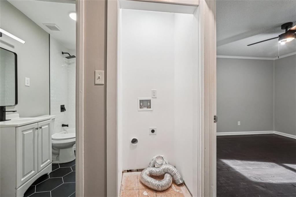 172 Meador Way Southeast Atlanta, GA 30315 - Photo 20 of 34 a bathroom with a granite countertop sink and a toilet