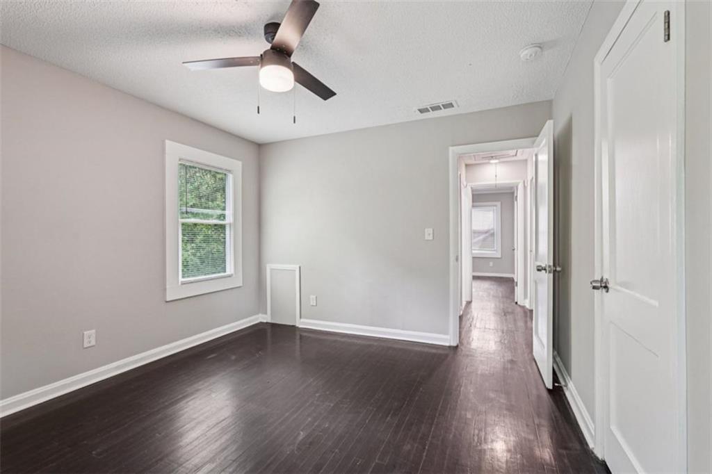 172 Meador Way Southeast Atlanta, GA 30315 - Photo 25 of 34 wooden floor in an empty room with a window