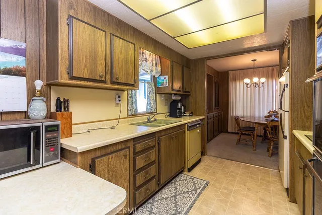 a kitchen with a refrigerator and a sink