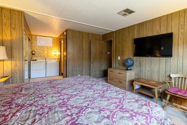 a view of a kitchen with a sink and cabinet