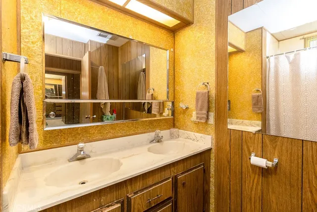 a dining room with furniture a chandelier and window