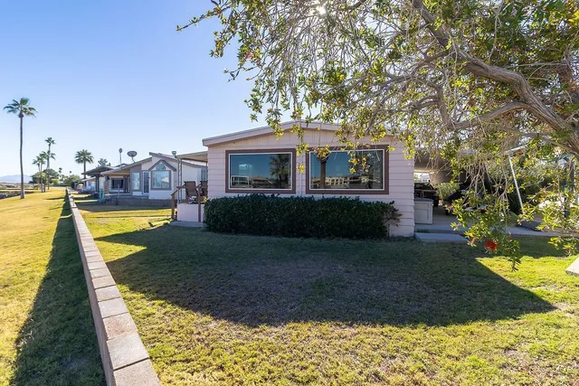 a view of swimming pool with a lounge chairs