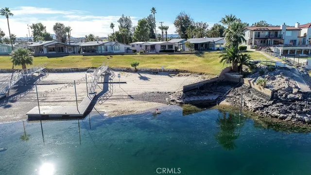 a view of a swimming pool with an outdoor seating and yard