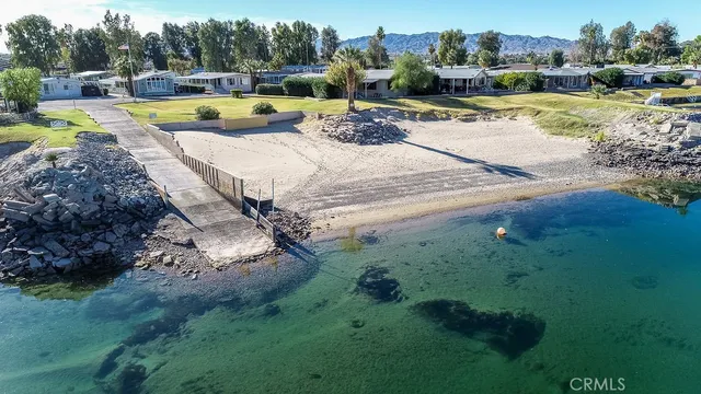 a view of a swimming pool with a yard
