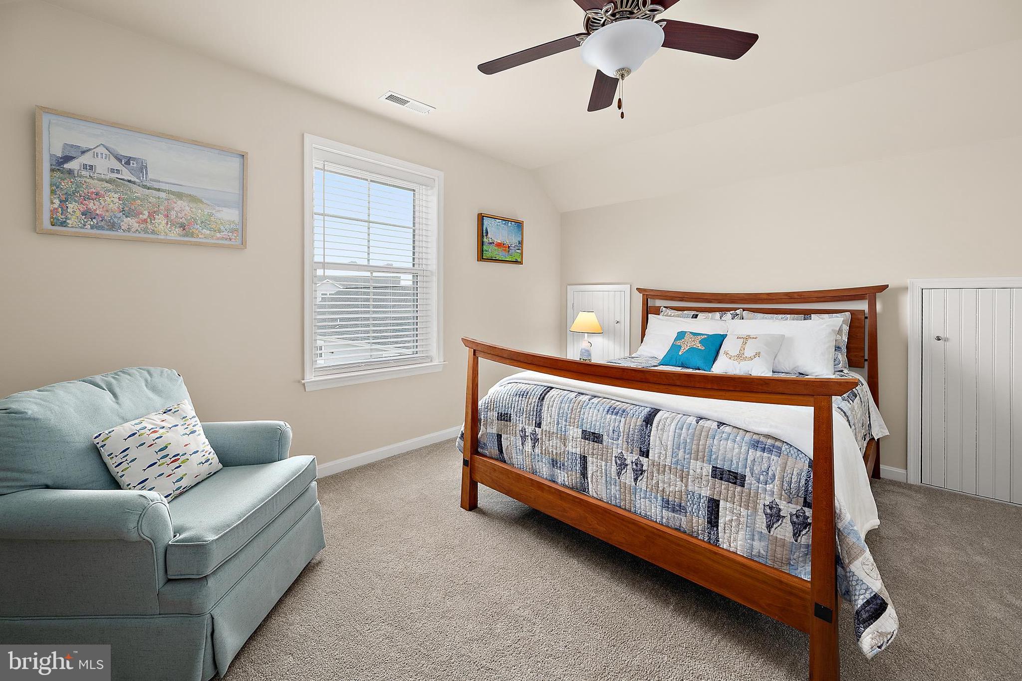 144 Clamshell Road Ocean City, MD 21842 - Photo 35 of 64 a bedroom with furniture and a window