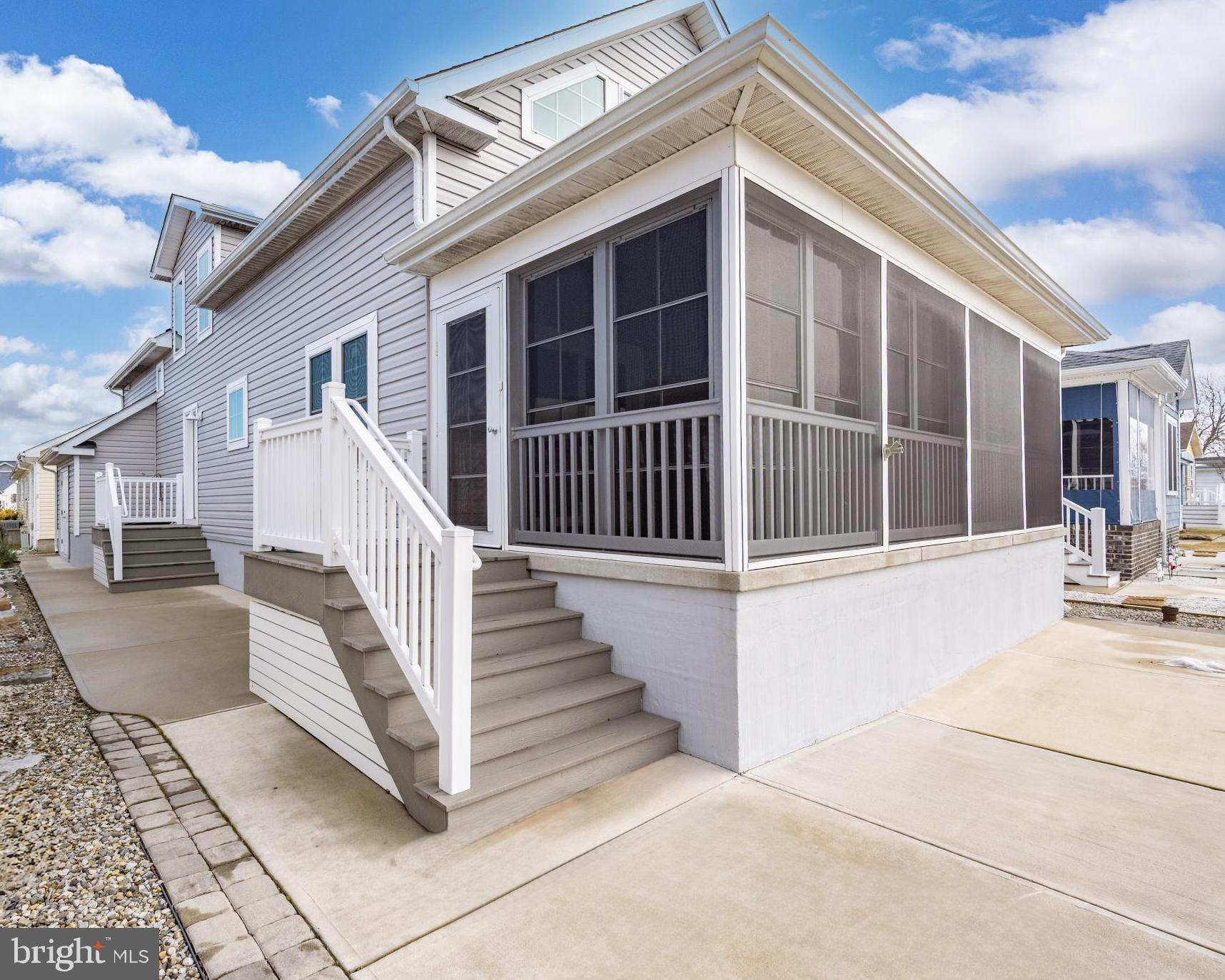 144 Clamshell Road Ocean City, MD 21842 - Photo 4 of 64 a view of a house with large windows