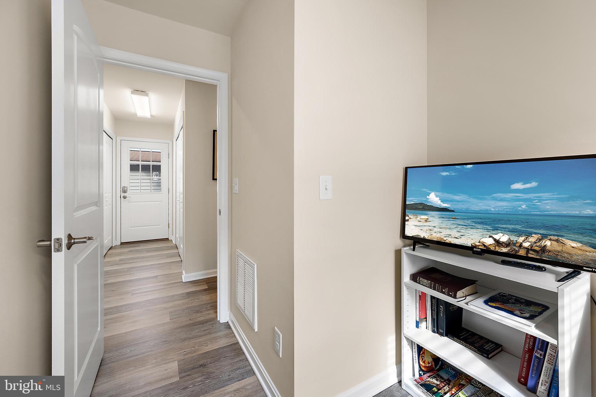 144 Clamshell Road Ocean City, MD 21842 - Photo 45 of 64 a view of a livingroom with wooden floor