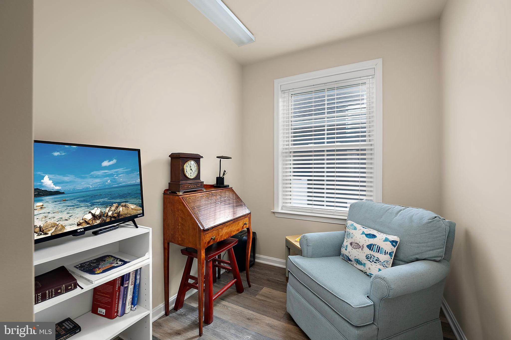 144 Clamshell Road Ocean City, MD 21842 - Photo 46 of 64 a living room with furniture and flat screen tv