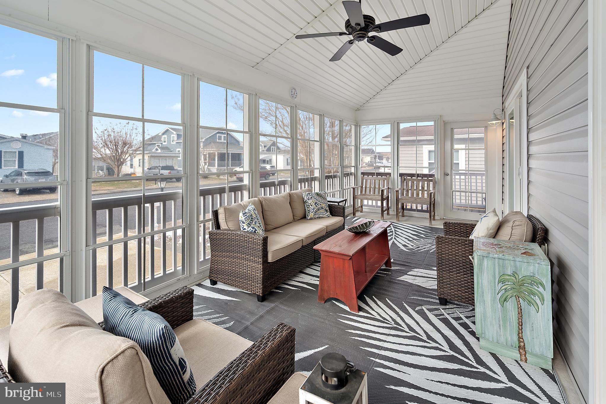 144 Clamshell Road Ocean City, MD 21842 - Photo 50 of 64 a living room with furniture and a large window
