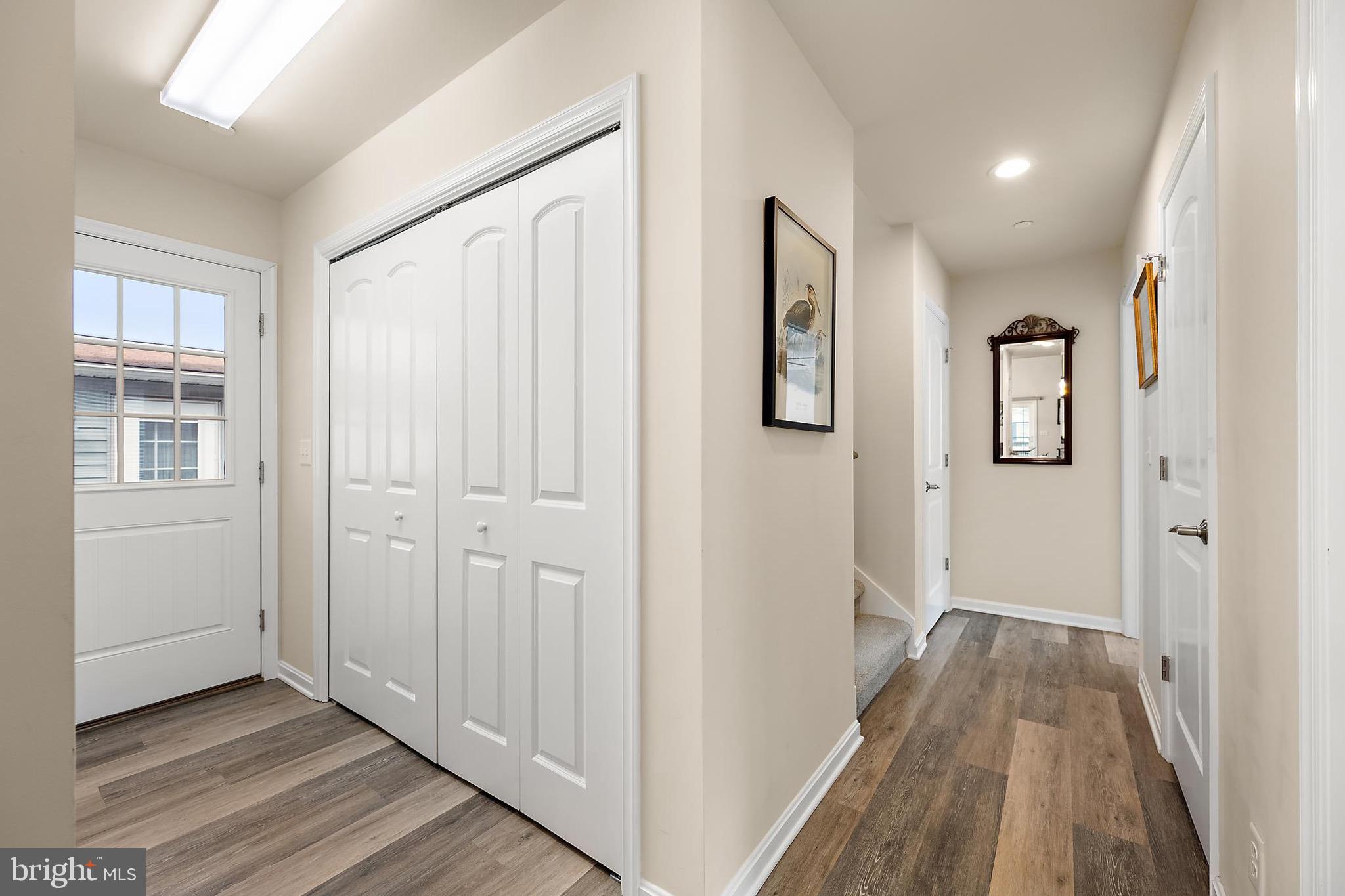 144 Clamshell Road Ocean City, MD 21842 - Photo 6 of 64 a view of a hallway with wooden floor and entryway